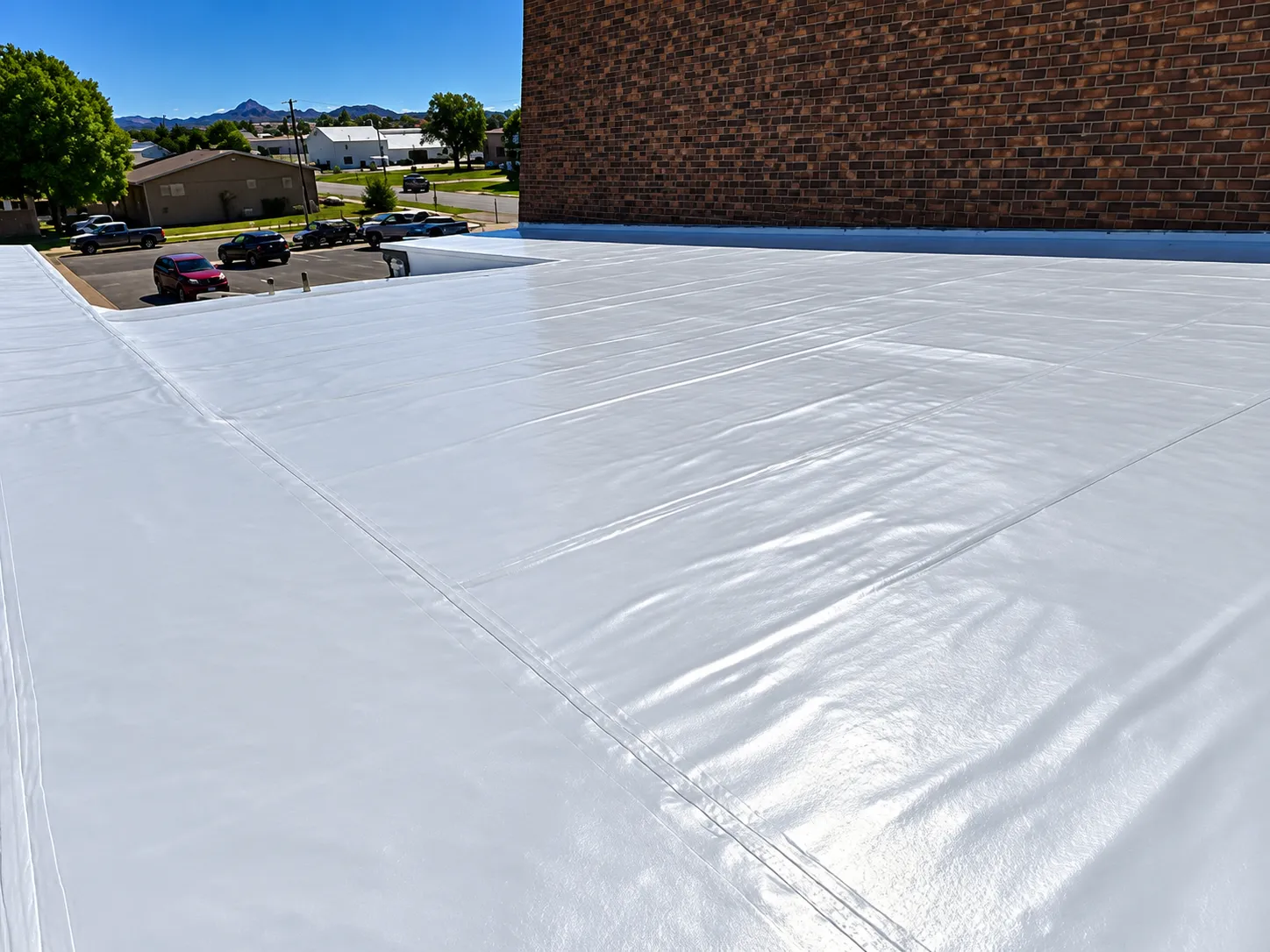 Finished white EPDM roof coating on a commercial flat roof
