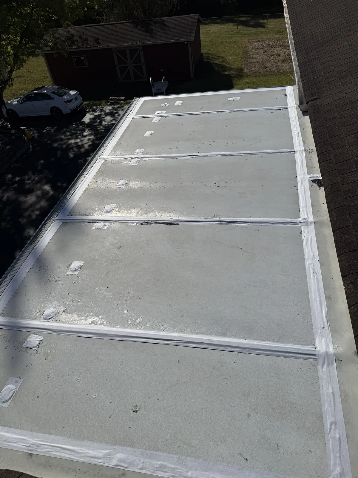 Flat roof with seams and fasteners taped, ready for liquid butyl coating