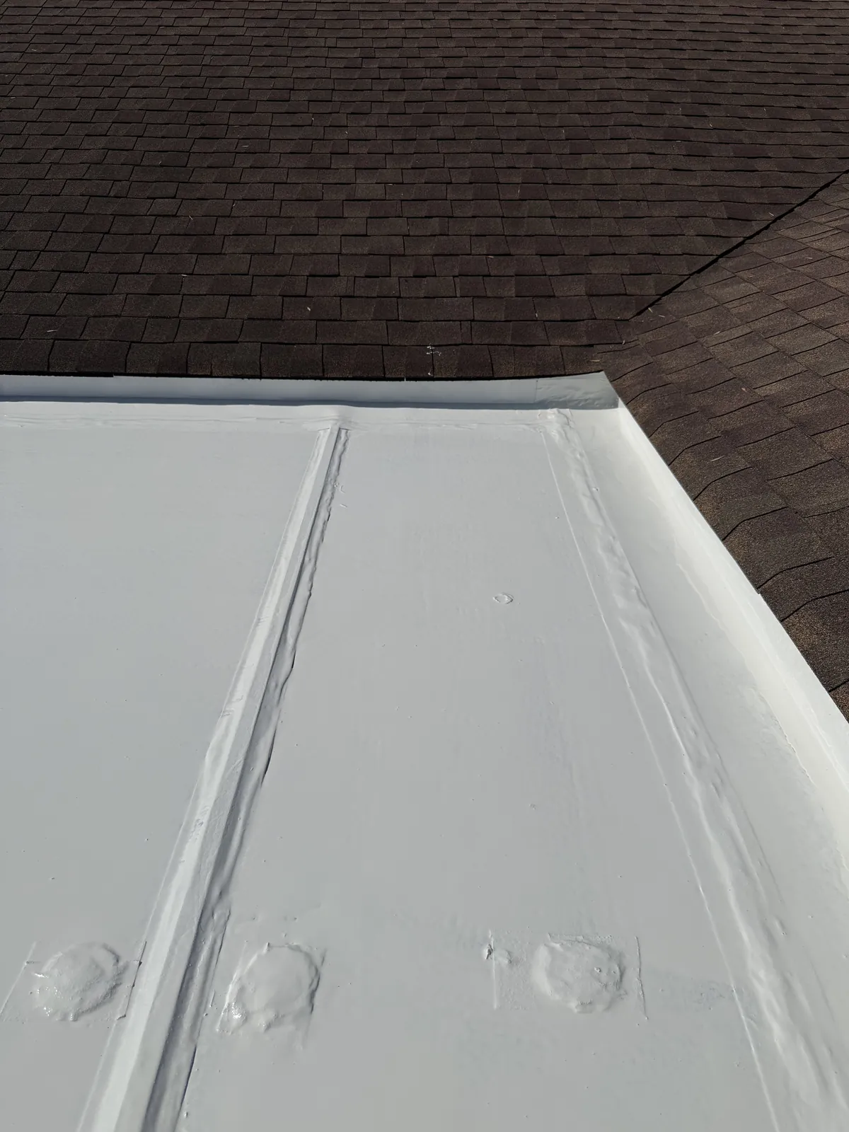 After: coated roof seams sealed with one coat of liquid butyl, no primer